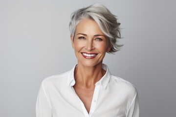 Fototapeta premium Beautiful model woman with grey hair isolated grey background