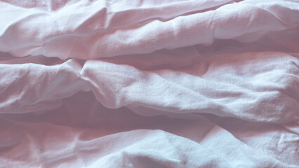 Wrinkled light pink and purple cotton fabric background