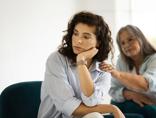 Depressed offended unhappy caucasian mature lady ignores mom, has stress after quarrel