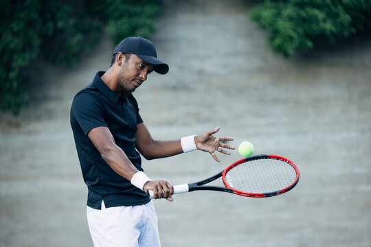 Tennis player returning the ball while practicing outdoors