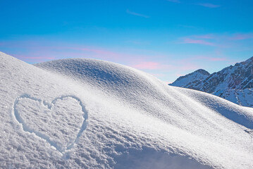 wintry slope with powder snow austrian alps. snowy heart shape and blue sky with copy space - obrazy, fototapety, plakaty
