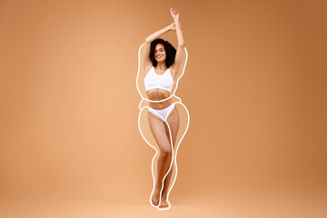African american woman in underwear with drawn outlines around figure