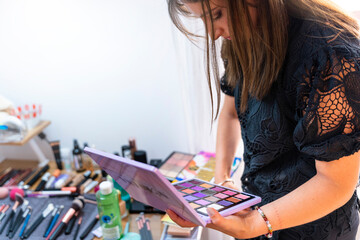 Fototapeta premium Makeup artist choosing colors for her work.