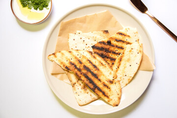 Vegan recipes with tortillas and wolffia spread on wooden plate. Wolffia is the nutrient-rich plant-based source of protein and omega3 and vital minerals.