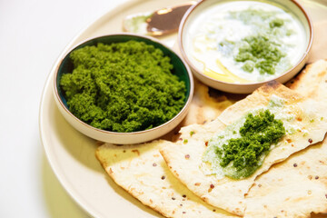 Vegan recipes with tortillas and wolffia spread on wooden plate. Wolffia is the nutrient-rich plant-based source of protein and omega3 and vital minerals.