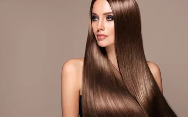  Beautiful model woman with shiny and straight long hair. Keratin straightening. Treatment, care and spa procedures. Beauty girl smooth hairstyle © Sofia Zhuravetc
