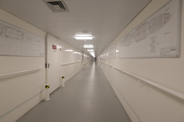crew area corridors and hallways on a cruise ship with emergency exit signs