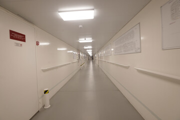 crew area corridors and hallways on a cruise ship with emergency exit signs