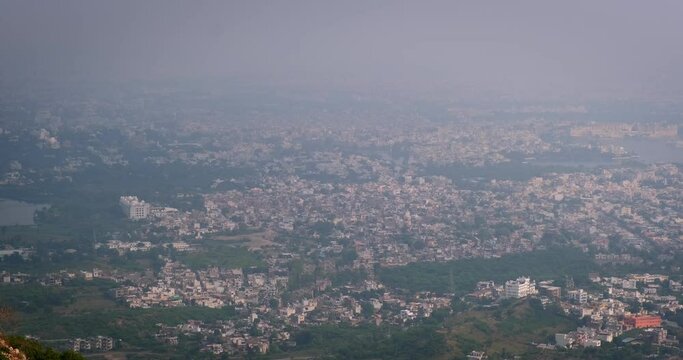 Panoramic aerial view of Udaipur city and lake Pichola from Sajjangarh Monsoon Palace , Rajasthan, India. Horizontal camera pan