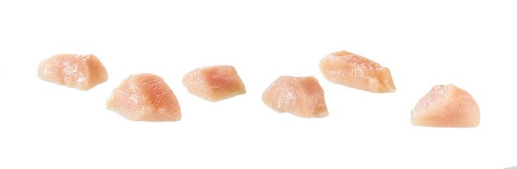 Pieces of raw chicken fillet isolated on white.  Chicken meat with clipping path.