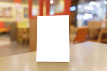 Menu mock up blank for text marketing promotion. Mock up Menu frame standing on wood table in...