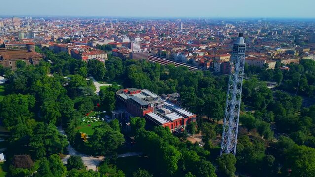 Aerial view of the branca tower summer trees in the sempione park, castello sforzesco. Triennale Milano Design Museum. View of modern skyscrapers. Ecology. Green Planet. Milan Italy 10.2023