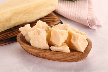Chopped Italian hard parmesan cheese
