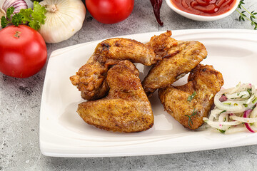 Grilled chicken wings with sauce
