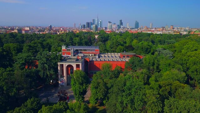 Aerial view of the summer trees in the sempione park next to the castello sforzesco. Triennale Milano Design Museum. View of modern skyscrapers. Ecology. Green Planet. Milan Italy
