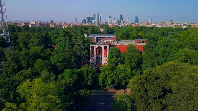Aerial view of the summer trees in the sempione park next to the castello sforzesco. Triennale Milano Design Museum. View of modern skyscrapers. Ecology. Green Planet. Milan Italy