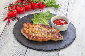 Grilled pork steak with ketchup