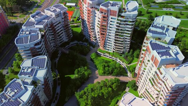 Glass buildings in Europe City Life. Aerial view of modern architecture of dwelling residences in the new districts of the city. Lights of the night city. three towers. Milan, Italy, 10.2023