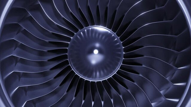 A large jet engine turbine full screen, with a lot of silver blades interconnected to each other and a central silver dome. Energy concept
