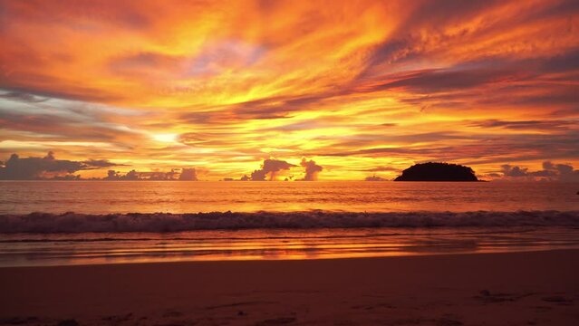 .Exotic colorful sky in bright red sunset at Kata beach Phuket..Scene of colorful romantic sky of sunset. Gradient color. Sky texture..amazing sky of bright sunset in nature and travel concept..