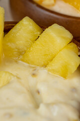 pineapple yogurt with slices of ripe yellow pineapple pineapples with fresh yogurt