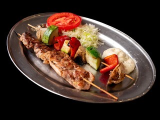 Fresh and healthy food: grilled meat with grilled vegetables and salad. Healthy eating and well-being on the dining table