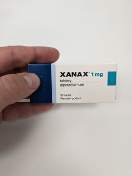 Prague,Czech republic – May 23 2023 : Xanax pills with active substance Alprazolam,anxiolytic anti-depressant medication therapy drugs,is a popular drug to abuse and has street value
