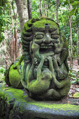 Stutue in Sacred Monkey Forest in Ubud, Bali, Indonesia.