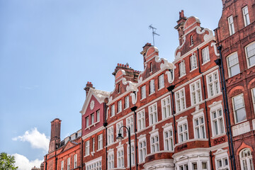 London, England - July 11, 2023: A classic red brick residential building in the Knightsbridge...