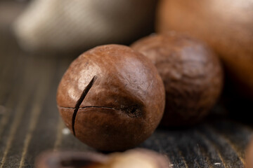 Unpeeled macadamia nuts on the table