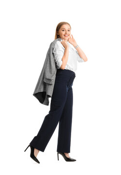 Pretty Young Businesswoman With Suit Over Shoulder Walking Forward On White Background