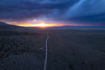 Storm over the plains at sunset