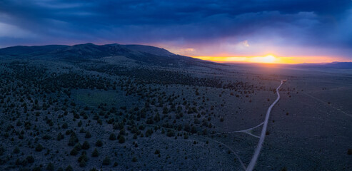 Storm over the plains at sunset