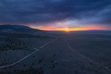 Storm over the plains at sunset