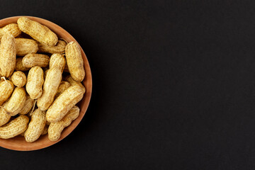 Roasted peanuts, peanuts in shell Isolated on black background