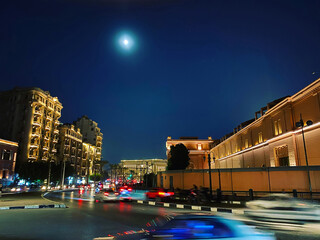 Moonlight, Tahrir square at night, city lights, blurred street traffic