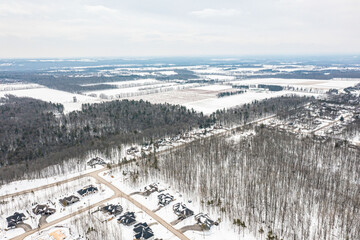 Fototapeta na wymiar Discover Barrie's tranquil outskirts with mesmerizing aerial views of Lake Simcoe. These drone photos capture the town's scenic beauty, making them ideal for local businesses, tourism agencies, and na