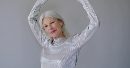 Portrait of Fashionable Senior Female model Posing in Studio - Powered by Adobe