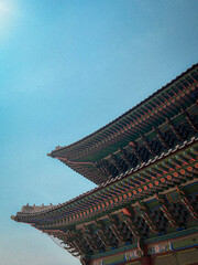 Korean temple roof on the blue sky background. 
