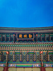 Korean temple roof on the blue sky background. 