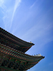 Korean temple roof on the blue sky background. 