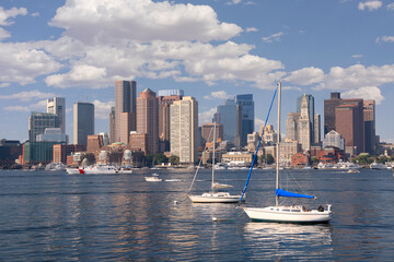 Fototapeta na wymiar Boston skyline and harbor with boats and Atlantic Ocean on the foreground, USA