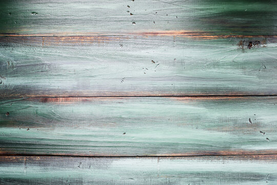 Table top view of bright green and wood wooden tone texture background. Image shot from overhead view.