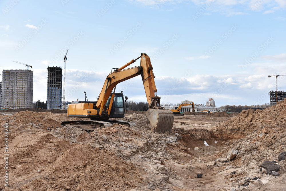 Poster excavator dig ground at construction site. dig foundation. construction of residential buildings and