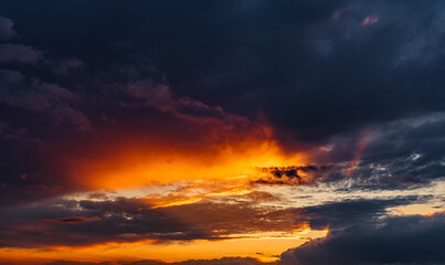 Fototapeta na wymiar Fiery evening sunset, orange-blue color.