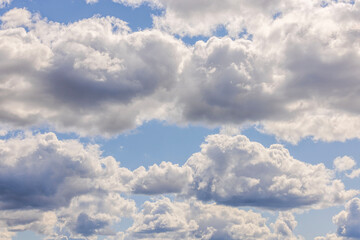 Beautiful view of puffy clouds on blue sky background. Beautiful background textures concept. 