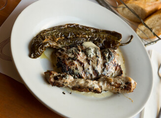Iberian pork in roquefort sauce with baked pepper. High quality photo