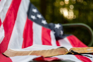 Close up of Bible and flag on a bench