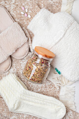 Hot water bottle, infusion tea, warm socks for seasonal cold anf fast recovery. Self care during cold weather