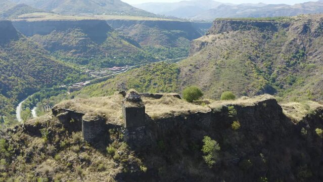 Orbital aerial shot of Kayan Fortress and Debed gorge on sunny summer day. Lori Province, Armenia.